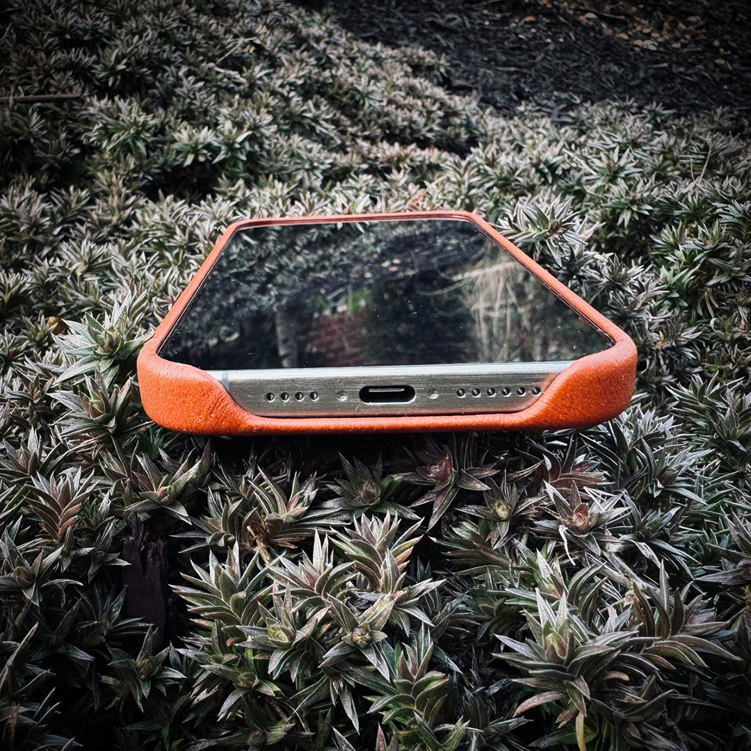 LUMAZI Sienna brown handmade, full-grain leather iPhone case bottom.