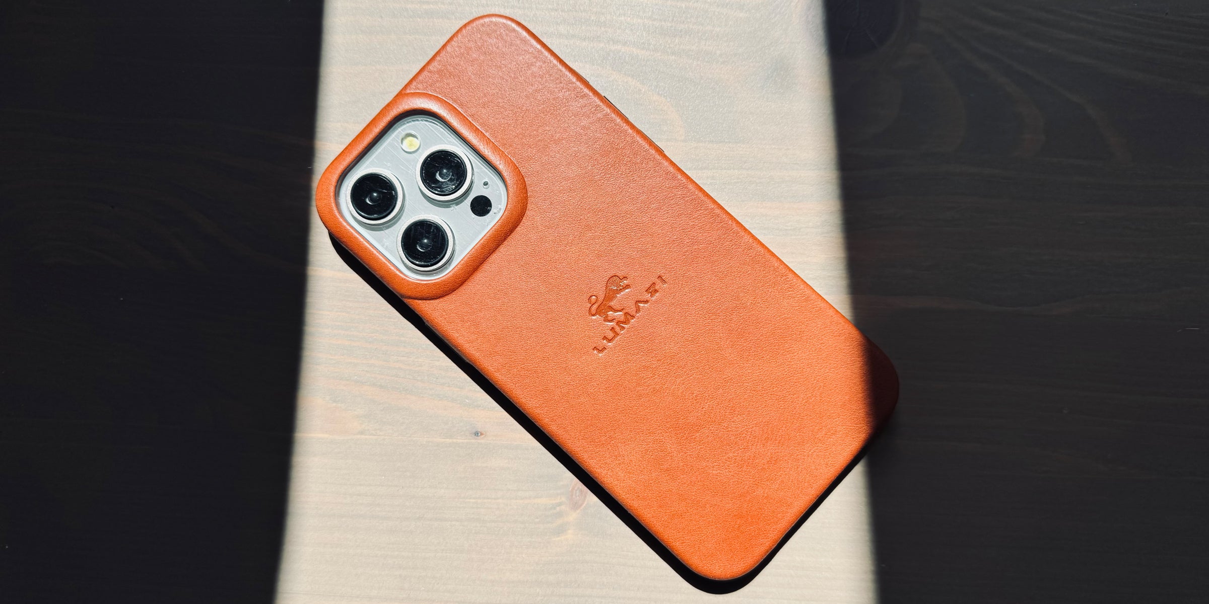 LUMAZI sienna brown, handmade, full grain leather iPhone case with MagSafe.